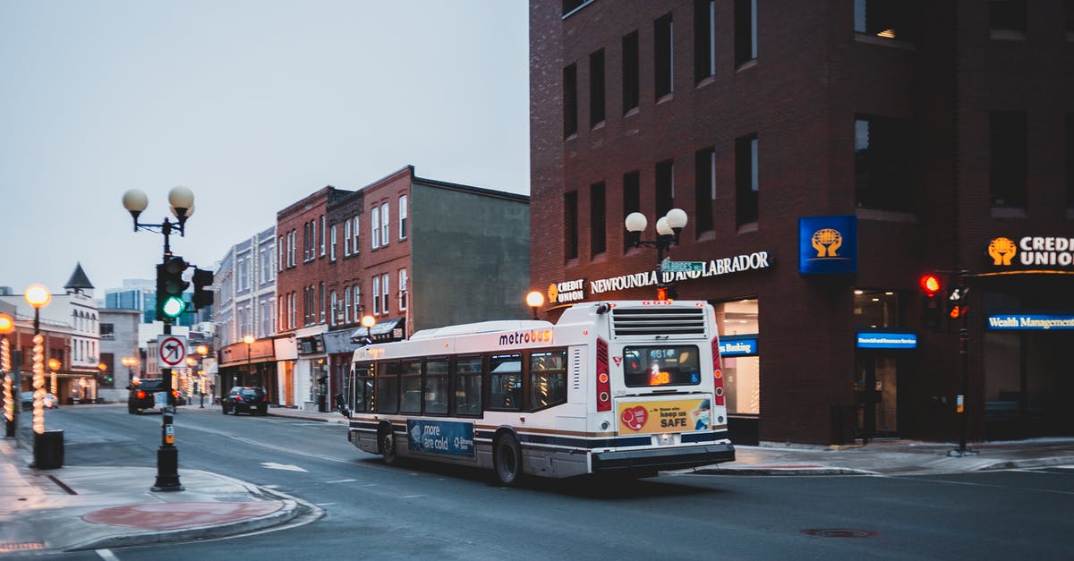What does amber - green traffic light mean in South Korea? - City street with bus driving on asphalt road What does amber - green traffic light mean in South Korea? - City street with bus driving on asphalt road