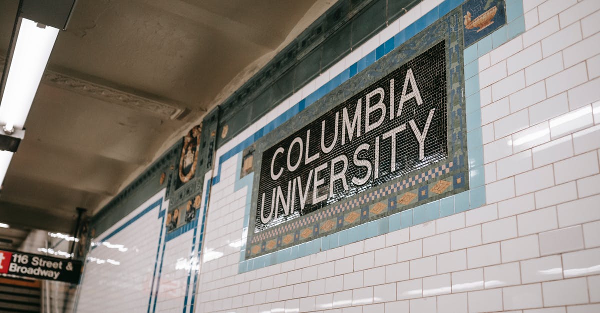 What does "MO" mean after the name of a US city? - From below of wall with inscription with name of underground station made of tile and mosaic What does "MO" mean after the name of a US city? - From below of wall with inscription with name of underground station made of tile and mosaic