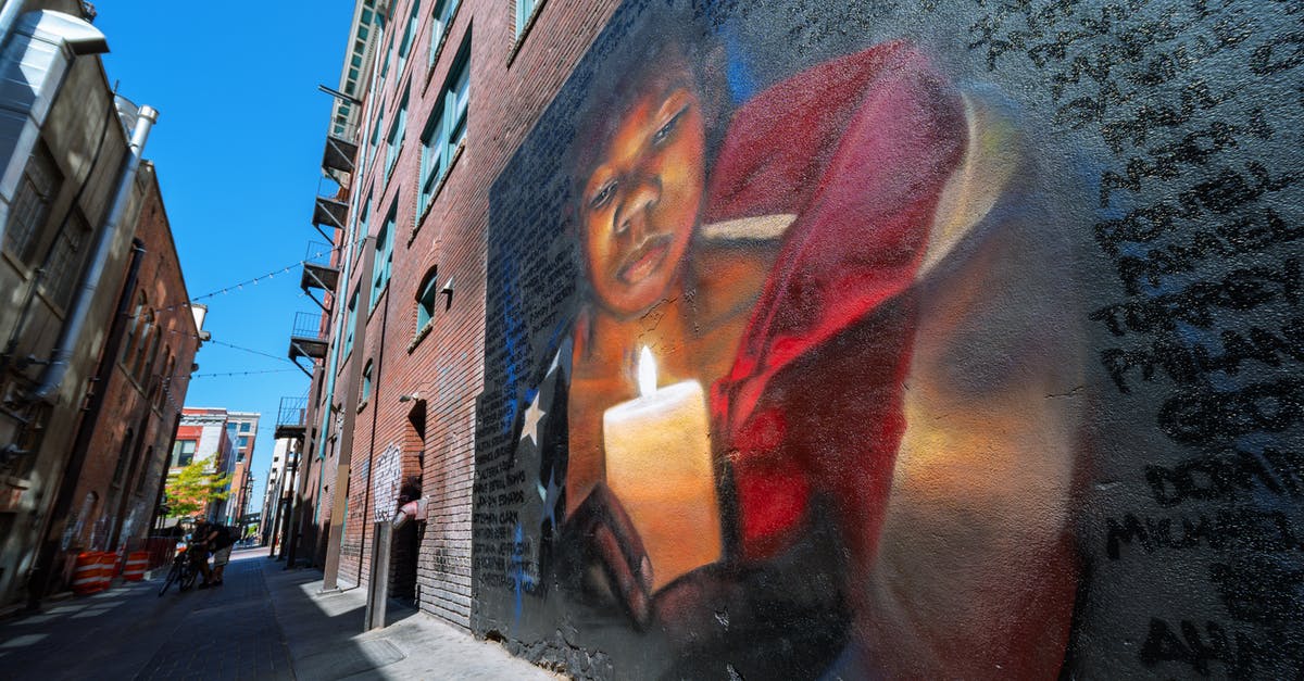 What does "MO" mean after the name of a US city? - Graffiti on brick wall on street What does "MO" mean after the name of a US city? - Graffiti on brick wall on street
