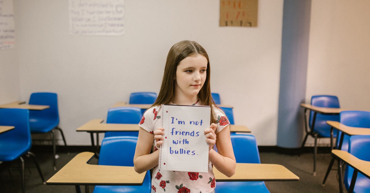 What does "WBCI SSR" stand for? - Girl Showing a Message Against Bullying Written in a Notebook What does "WBCI SSR" stand for? - Girl Showing a Message Against Bullying Written in a Notebook