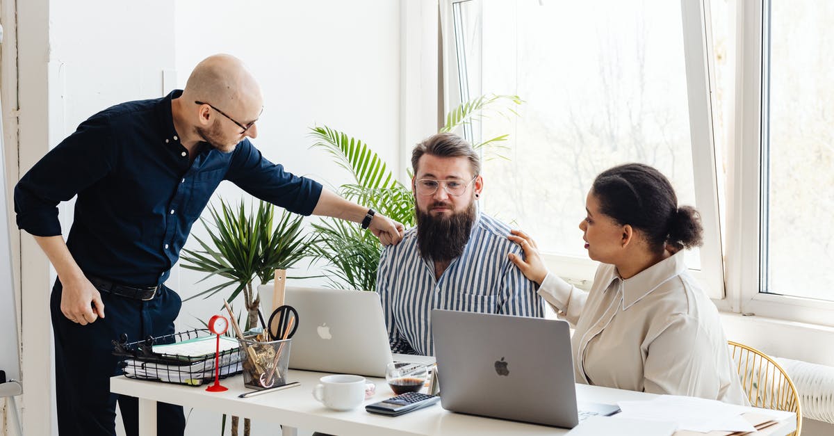 What does the acronym "ECO" mean in discussions of visas? - Man in Blue Long Sleeve Shirt Sitting Beside Woman in White Long Sleeve Shirt Using Macbook What does the acronym "ECO" mean in discussions of visas? - Man in Blue Long Sleeve Shirt Sitting Beside Woman in White Long Sleeve Shirt Using Macbook