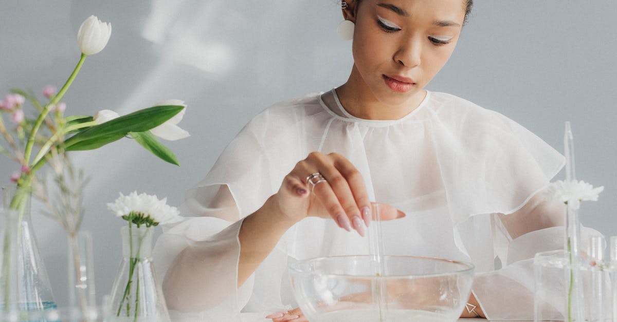 What does the appeals process look like if you are denied entry to the United States? - Woman in White Making Table Arrangement Looking Like Science Laboratory
