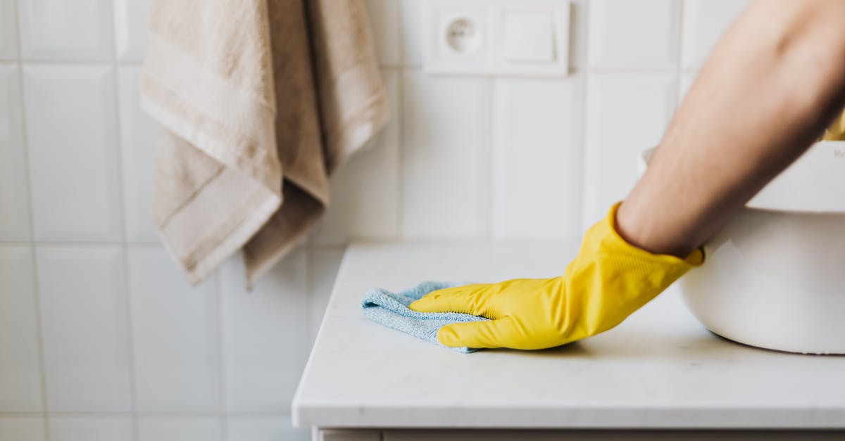 What does the TSA consider to be household cleaners? - Crop housewife cleaning surface near sink What does the TSA consider to be household cleaners? - Crop housewife cleaning surface near sink