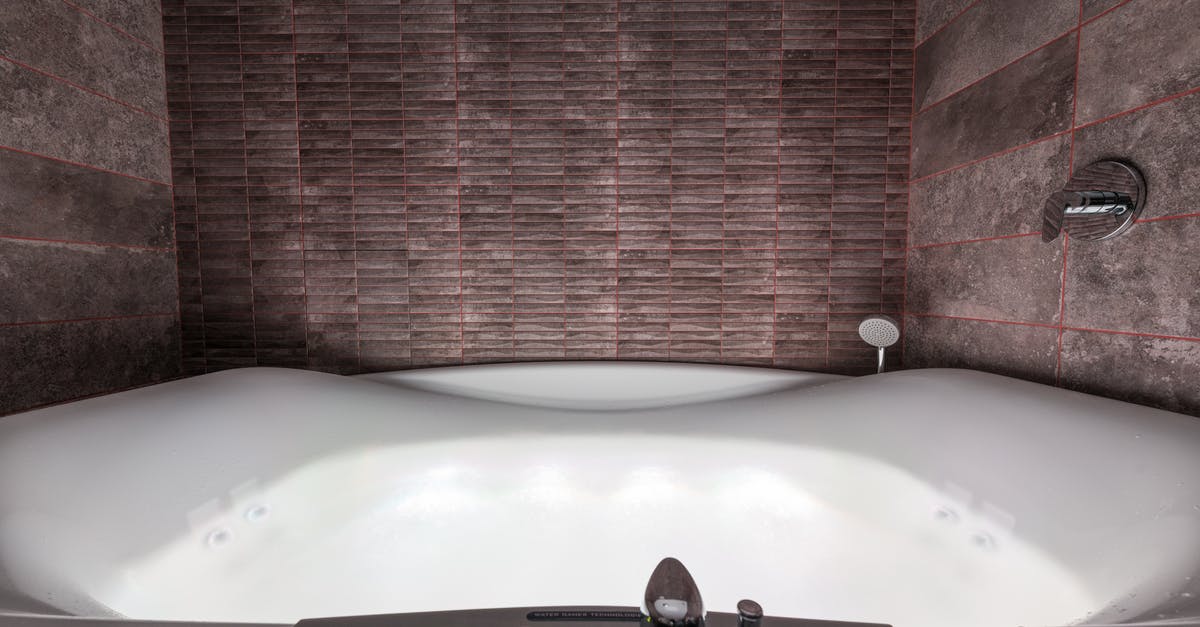 What does this control do on new airplanes? - Modern white ceramic tub with illumination and contemporary control panel with buttons and levers placed in stylish bathroom among walls What does this control do on new airplanes? - Modern white ceramic tub with illumination and contemporary control panel with buttons and levers placed in stylish bathroom among walls