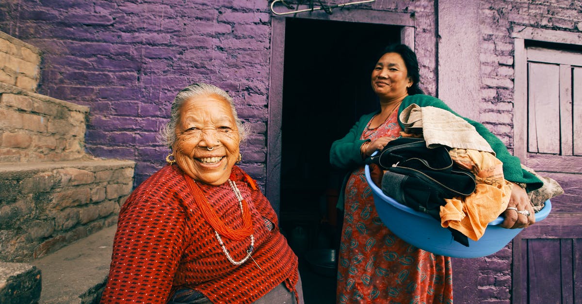 What does under two years old mean? - Two Women Posing in Front of Slum Violet House What does under two years old mean? - Two Women Posing in Front of Slum Violet House
