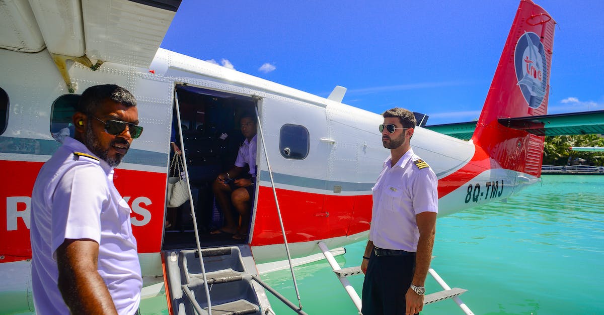 What exactly is a open-jaw flight? - Man Standing Beside of White and Red Airplane What exactly is a open-jaw flight? - Man Standing Beside of White and Red Airplane