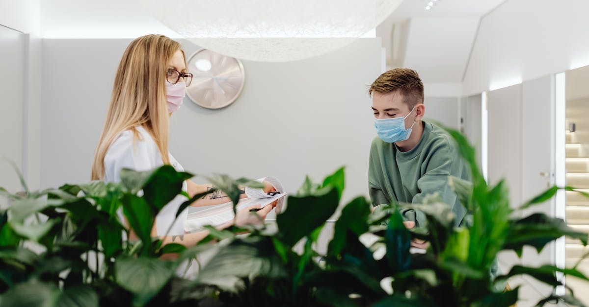 What facilities are there in the Thalys Lounge at Brussels Midi station? - Woman and Man in Waiting Room in Clinic What facilities are there in the Thalys Lounge at Brussels Midi station? - Woman and Man in Waiting Room in Clinic