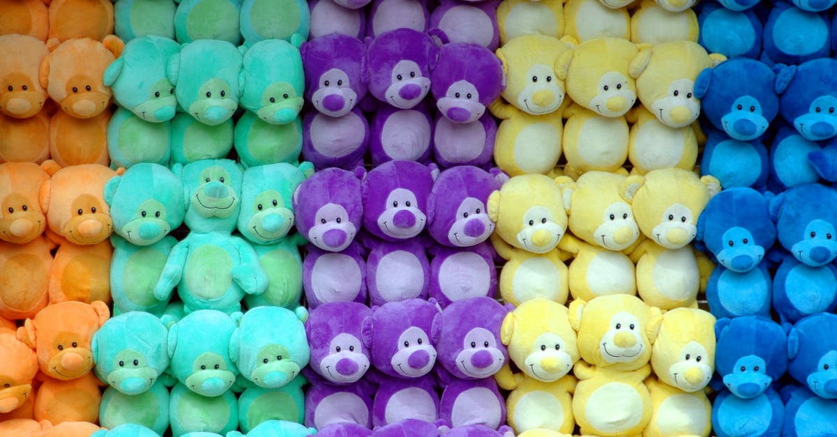What games can I play with friends in the confined space of the seating on a long flight? [closed] - Pile of Plush Toy