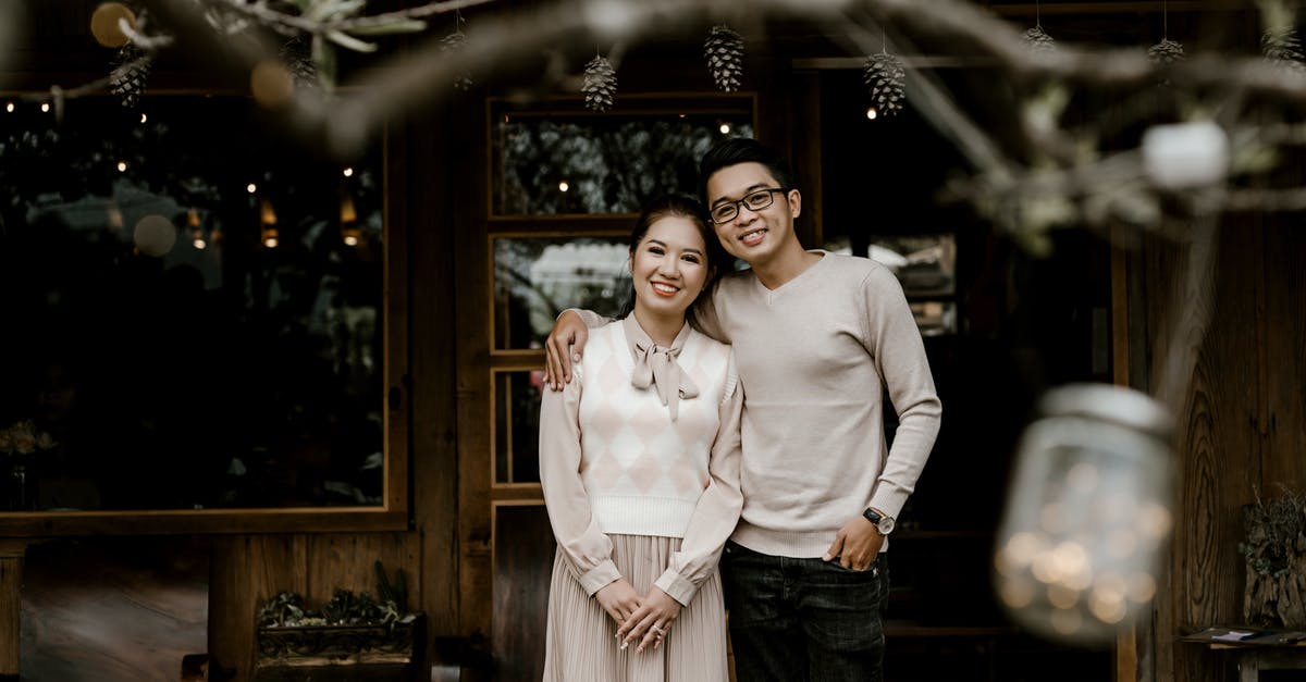 What gifts would be welcome for a Swedish host family? - Man in White Long Sleeve Shirt Carrying Baby in Yellow Onesie What gifts would be welcome for a Swedish host family? - Man in White Long Sleeve Shirt Carrying Baby in Yellow Onesie