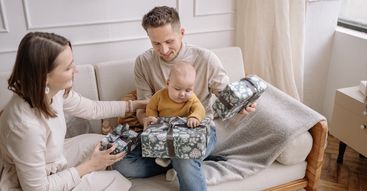 What gifts would be welcome for a Swedish host family? - Happy young husband hugging wife on terrace of wooden house near blurred leafless tree What gifts would be welcome for a Swedish host family? - Happy young husband hugging wife on terrace of wooden house near blurred leafless tree