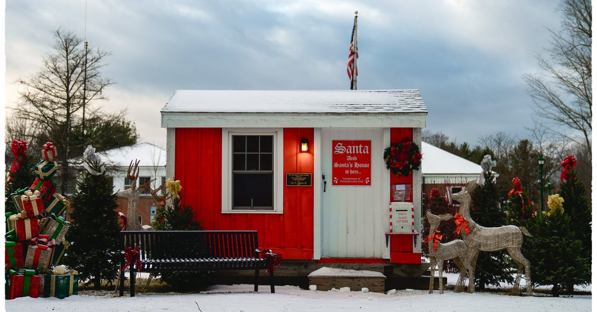 What goes on in Amsterdam during New Year's Eve? - Small modern Santa house with USA flag and festive decorations What goes on in Amsterdam during New Year's Eve? - Small modern Santa house with USA flag and festive decorations