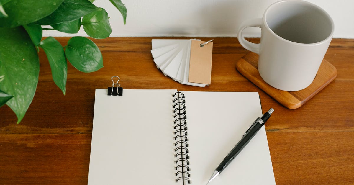 What happens if the visa label page gets torn from passport? - Stationery near mug and plant