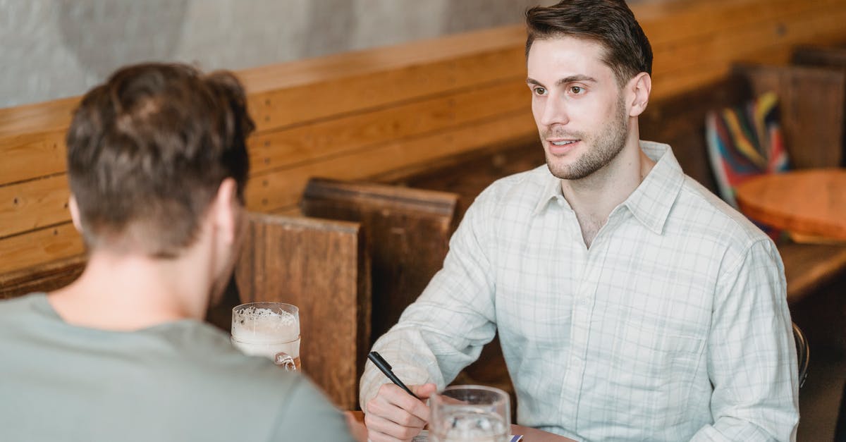 What happens when you exceed the import limits of alcohol in Norway? - Business partners talking while signing agreement at table with beer What happens when you exceed the import limits of alcohol in Norway? - Business partners talking while signing agreement at table with beer