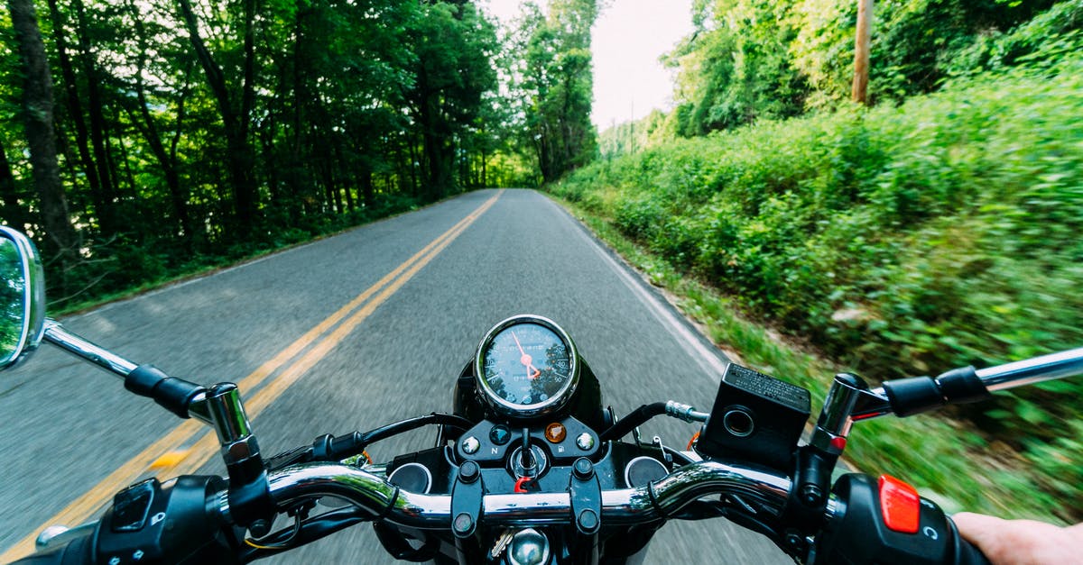 What immigration lane do I use as a group? [closed] - Person Riding Motorcycle on Road