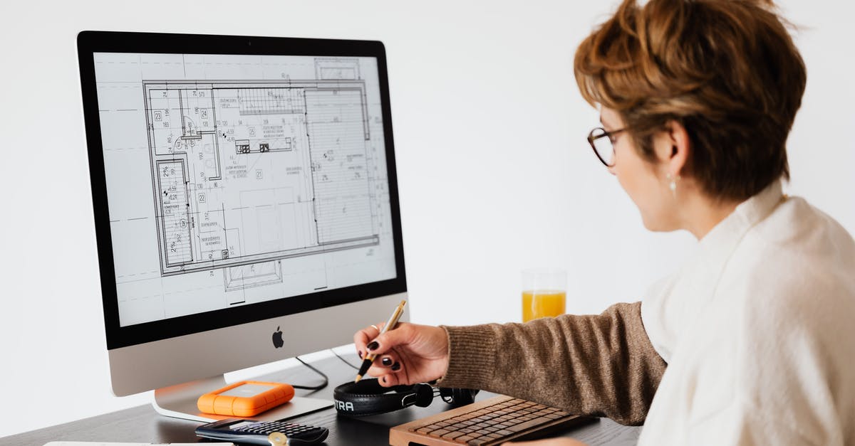 What is a good data plan for Internet surfing in northern Italy? [duplicate] - Side view of anonymous female employee in casual clothes and eyeglasses writing out information from computer while working at table in modern light office