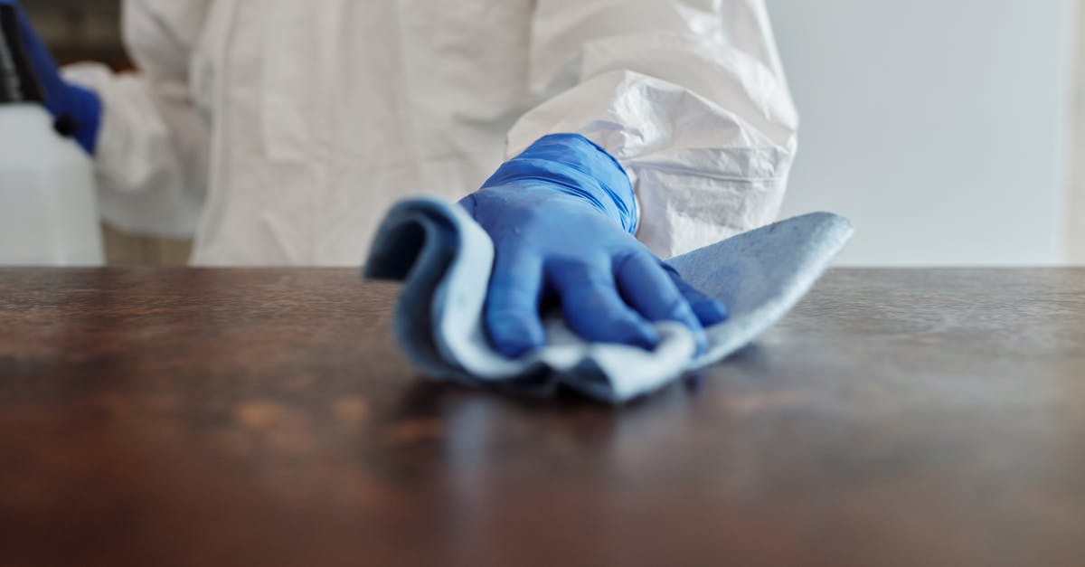 What is a typical room cleaning tip in Montreal? - Close-Up Photo Of Person Cleaning The Table What is a typical room cleaning tip in Montreal? - Close-Up Photo Of Person Cleaning The Table