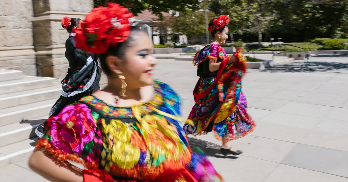 What is France's traditional costume? - Woman in Yellow and Blue Dress With Red and Yellow Floral Headdress What is France's traditional costume? - Woman in Yellow and Blue Dress With Red and Yellow Floral Headdress