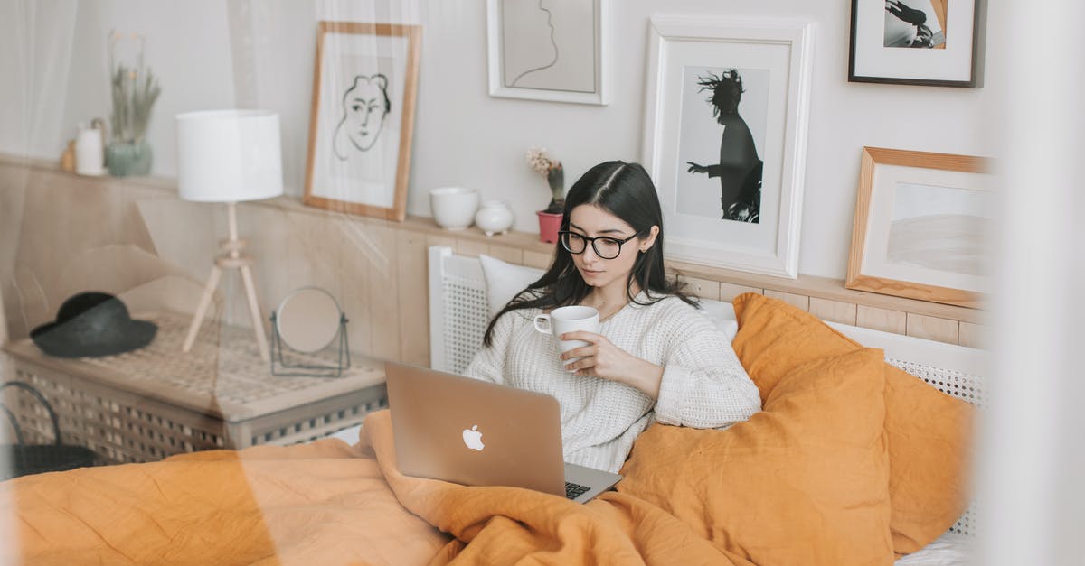 What is more efficient when connecting through LCY: LHR or LGW? - Focused young brunette in eyeglasses with cup of hot drink lying in comfortable bed and working on laptop in morning What is more efficient when connecting through LCY: LHR or LGW? - Focused young brunette in eyeglasses with cup of hot drink lying in comfortable bed and working on laptop in morning