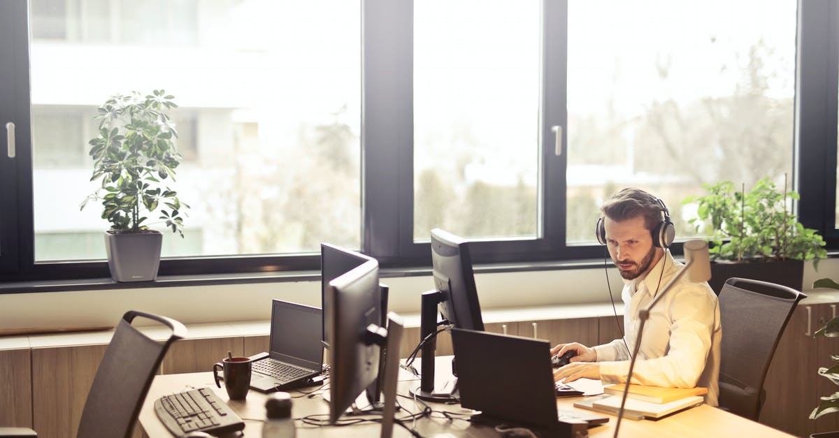 What is "cattle call seating policy"? - Man With Headphones Facing Computer Monitor What is "cattle call seating policy"? - Man With Headphones Facing Computer Monitor