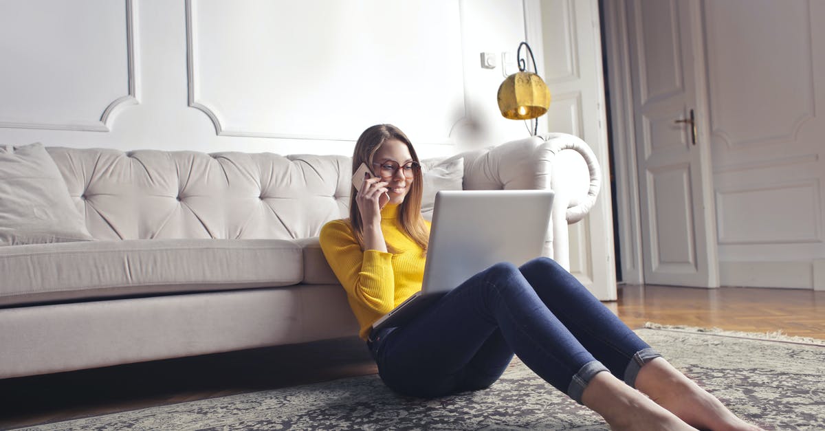 What is "cattle call seating policy"? - Smiling barefoot female in glasses and casual clothes using laptop and having phone call while sitting on floor leaning on sofa and working on laptop against luxury interior of light living room What is "cattle call seating policy"? - Smiling barefoot female in glasses and casual clothes using laptop and having phone call while sitting on floor leaning on sofa and working on laptop against luxury interior of light living room