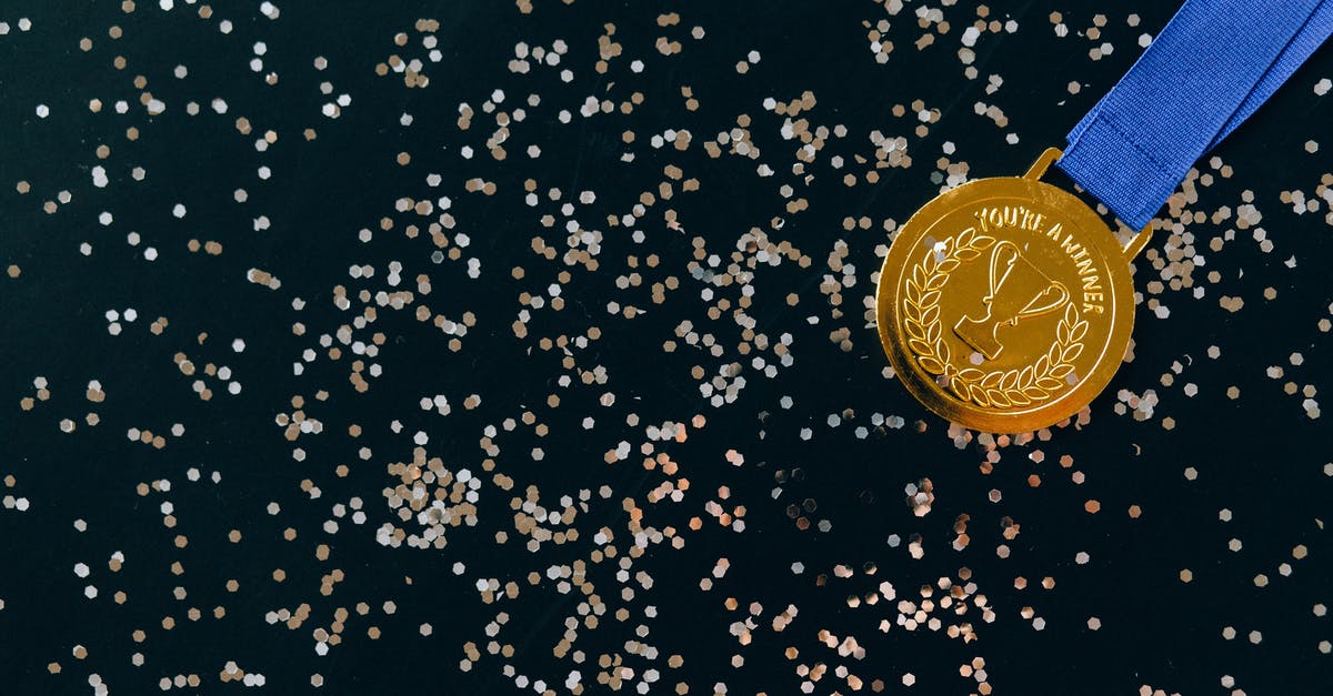 What is Successful Ratio of Climbing K2? [closed] - Close-Up Shot of a Gold Medal on a Black Surface