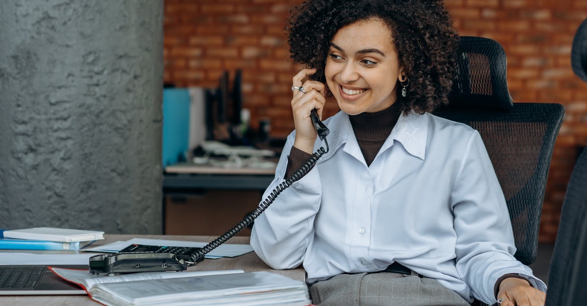 What is the AXA Schengen Insurance office phone number? - Woman in White Dress Shirt Sitting on Chair What is the AXA Schengen Insurance office phone number? - Woman in White Dress Shirt Sitting on Chair