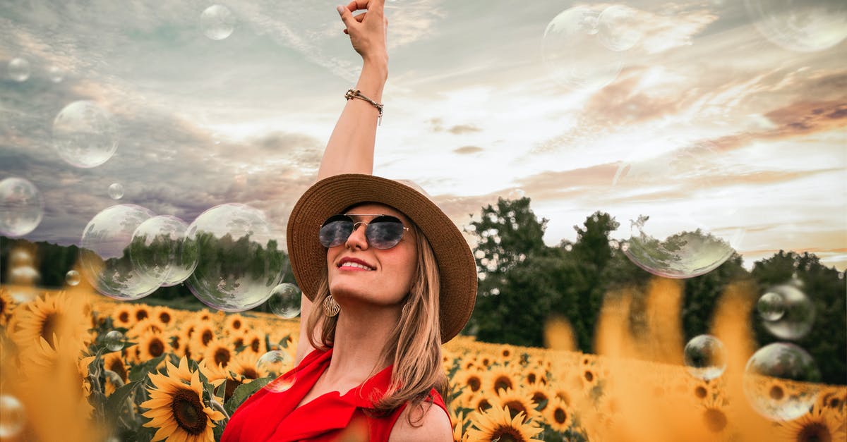 What is the biggest hard-shell hand luggage model (by usable volume) that fits Ryanair's official limits and is sold in Europe? [closed] - Woman Surrounded by Sunflowers Raising Hand