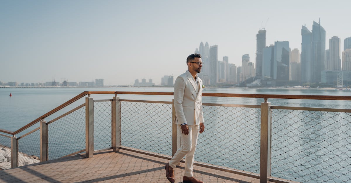 What is the business model of commercial free walking tours? - Walking Man Wearing White Suit Beside Fence What is the business model of commercial free walking tours? - Walking Man Wearing White Suit Beside Fence