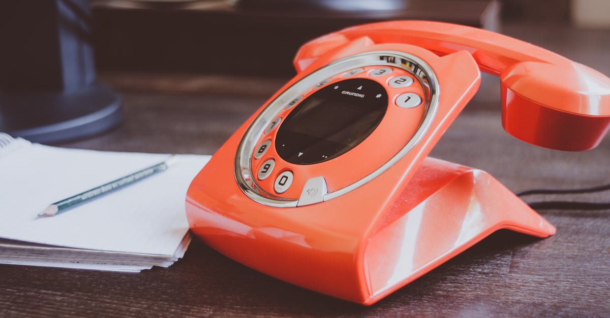 What is the French phone number for medical emergencies? - Red Cradle Telephone on Brown Wooden Surface What is the French phone number for medical emergencies? - Red Cradle Telephone on Brown Wooden Surface