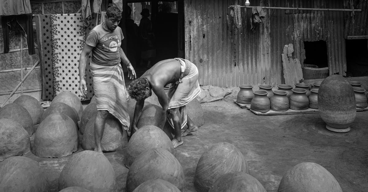What is the immigration process when leaving the Philippines? - Grayscale Photo of Man and Woman Sitting on Round Wooden Table What is the immigration process when leaving the Philippines? - Grayscale Photo of Man and Woman Sitting on Round Wooden Table
