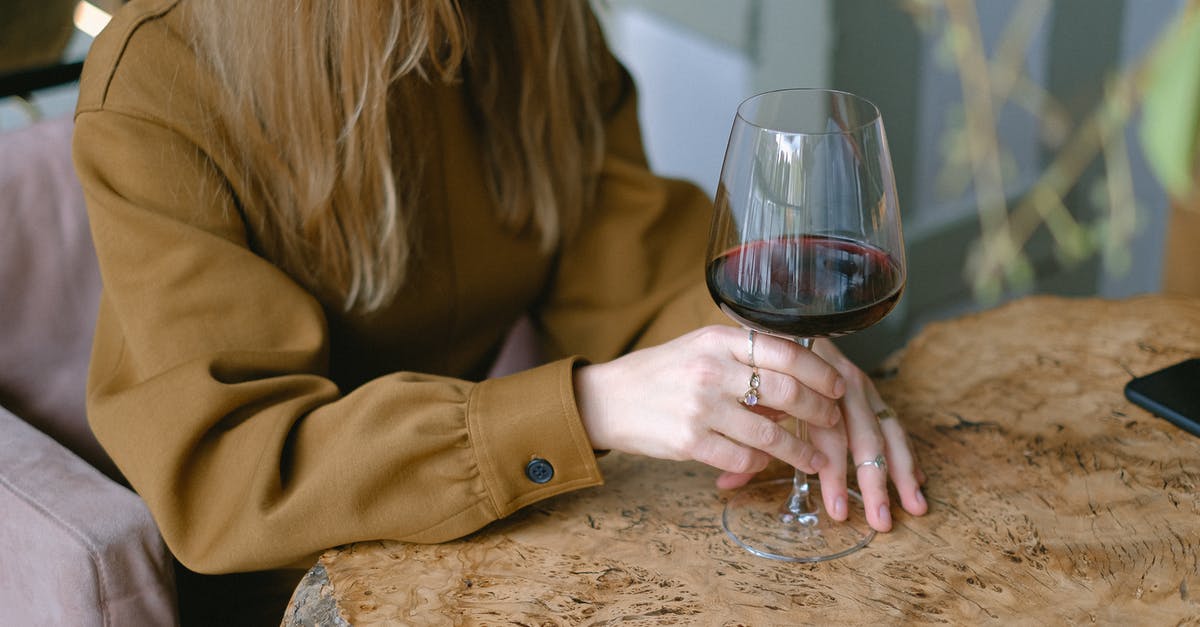 What is the largest pub/bar in Europe? - Close-up of Woman Sitting at Table Drinking Wine What is the largest pub/bar in Europe? - Close-up of Woman Sitting at Table Drinking Wine