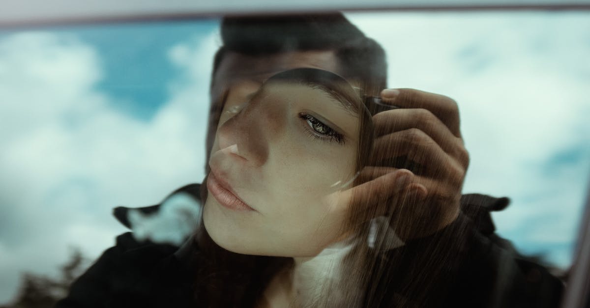 What is the longest distance by car ferry? - Unrecognizable man taking photo of pensive young female sitting in car and looking through window What is the longest distance by car ferry? - Unrecognizable man taking photo of pensive young female sitting in car and looking through window