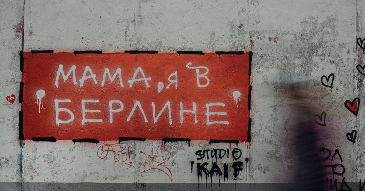 What is the main spoken language in Kiev: Ukrainian or Russian? - Red and White Wall Mounted Signage What is the main spoken language in Kiev: Ukrainian or Russian? - Red and White Wall Mounted Signage