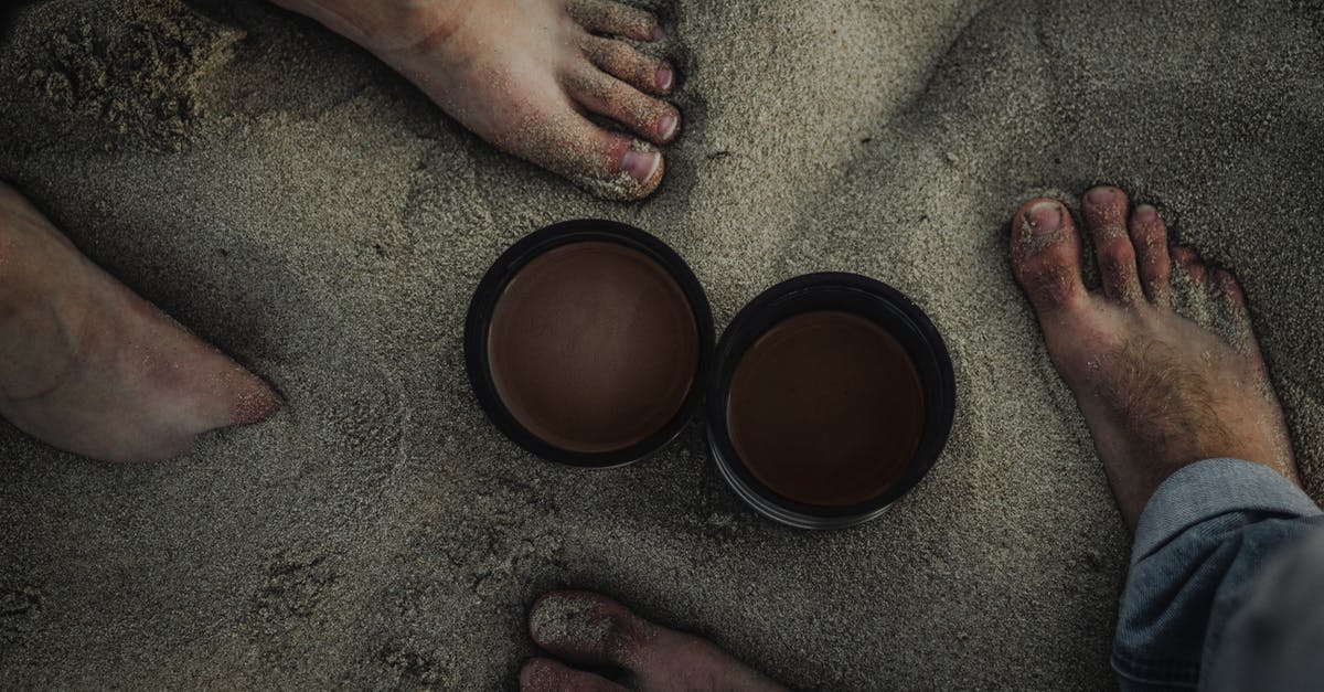 What is the meaning of intended travel date in UK Visa application form: the starting date from own country or arrival date in UK? - Top view of crop unrecognizable barefoot couple of travelers standing on sandy coast hot drinks in thermos lids in overcast day What is the meaning of intended travel date in UK Visa application form: the starting date from own country or arrival date in UK? - Top view of crop unrecognizable barefoot couple of travelers standing on sandy coast hot drinks in thermos lids in overcast day