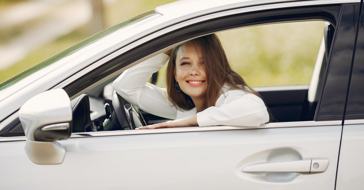 What is the minimum age to drive and to rent a car for a trip between Los Angeles and Las Vegas? - Cheerful female driver in white shirt sitting inside modern automobile and looking at camera through opened side window with smile during car trip in summer day What is the minimum age to drive and to rent a car for a trip between Los Angeles and Las Vegas? - Cheerful female driver in white shirt sitting inside modern automobile and looking at camera through opened side window with smile during car trip in summer day