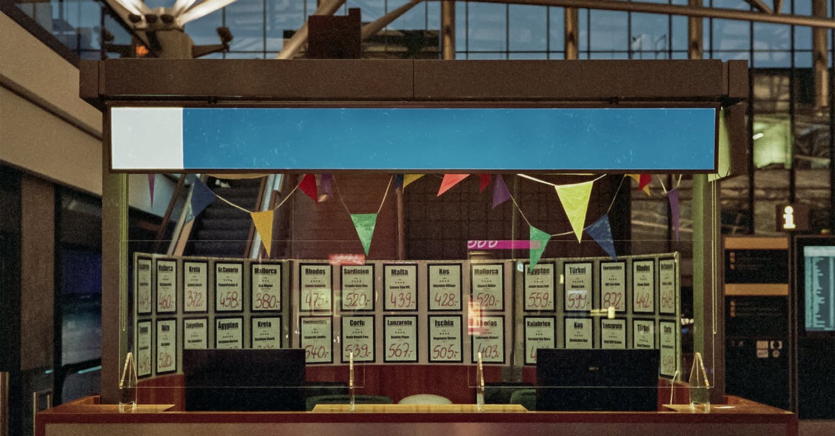 What is the minimum time to check-in at the counter for an international flight with United Airlines where the first leg is domestic? - Brown Wooden Bench Near Brown Wooden Table