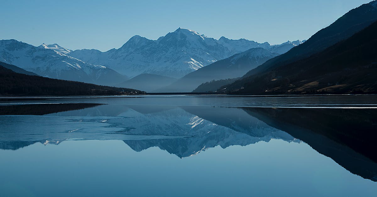 What is the most accurate snow report website? - Calm Body of Lake Between Mountains What is the most accurate snow report website? - Calm Body of Lake Between Mountains
