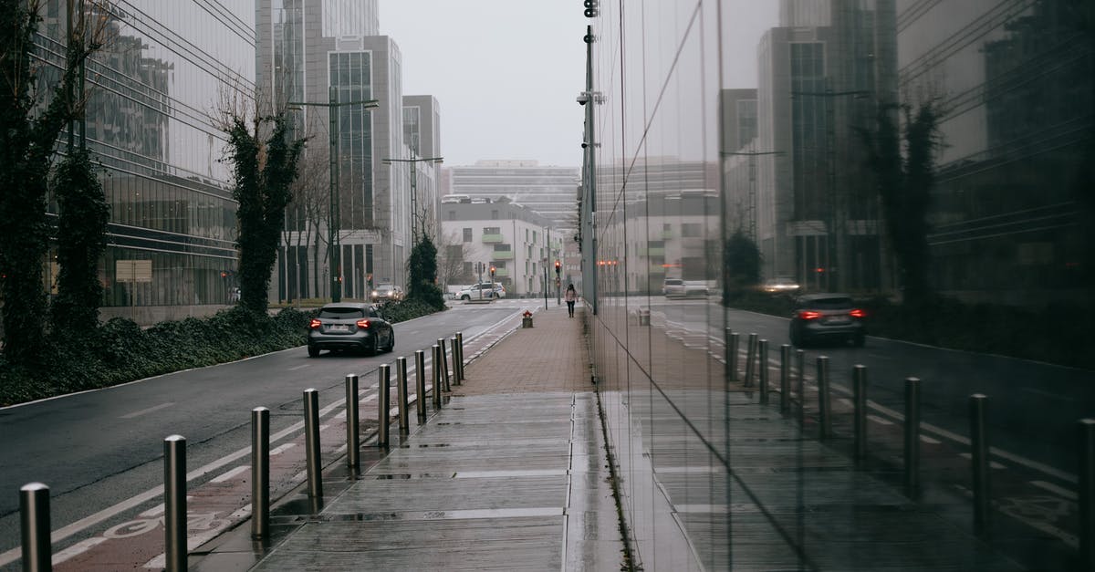 What is the most campsite-dense route between Belgium and the Tatras? - Modern city street with glass building on overcast rainy day What is the most campsite-dense route between Belgium and the Tatras? - Modern city street with glass building on overcast rainy day