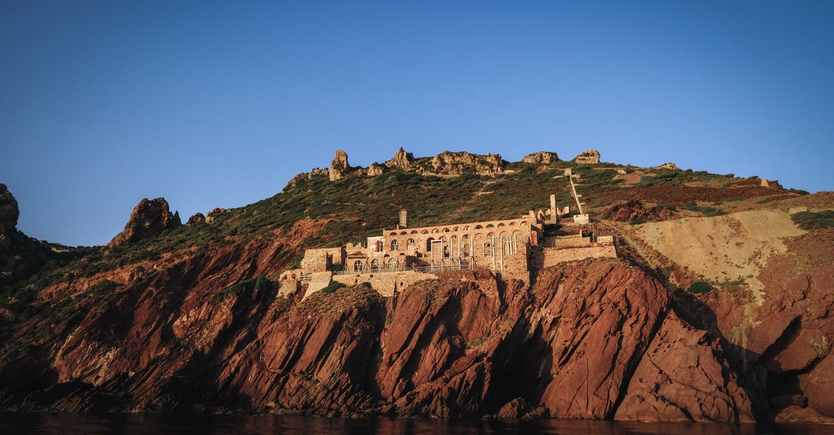 What is the most well-preserved ancient ruin in Sardinia? - Old mining complex built on rocky cliff above sea in Sardinia What is the most well-preserved ancient ruin in Sardinia? - Old mining complex built on rocky cliff above sea in Sardinia