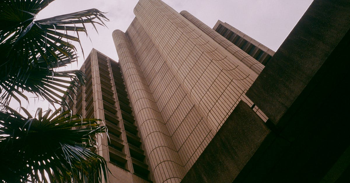 What is the name for the tall concrete tower in the southwest of Paris? - Worms-eye-view Photography of Brown Building What is the name for the tall concrete tower in the southwest of Paris? - Worms-eye-view Photography of Brown Building