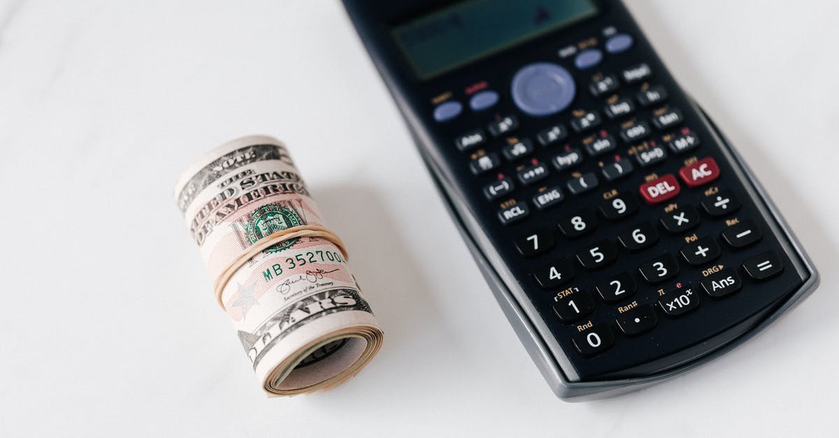 What is the National Identification Number of Dutch citizens? - From above of modern electronic calculator with small display and buttons of different colors near roll of dollar bills on marble surface What is the National Identification Number of Dutch citizens? - From above of modern electronic calculator with small display and buttons of different colors near roll of dollar bills on marble surface