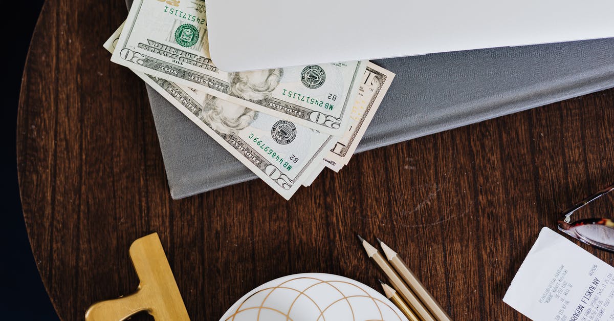 What is the purpose of carrying a flight ticket receipt on paper? [closed] - Paper Money Under a Laptop