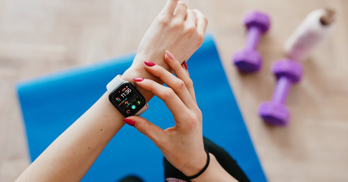 What is the "U.S. point of contact" in the ESTA application used for? - Anonymous sportswoman checking smart watch and sitting on mat What is the "U.S. point of contact" in the ESTA application used for? - Anonymous sportswoman checking smart watch and sitting on mat