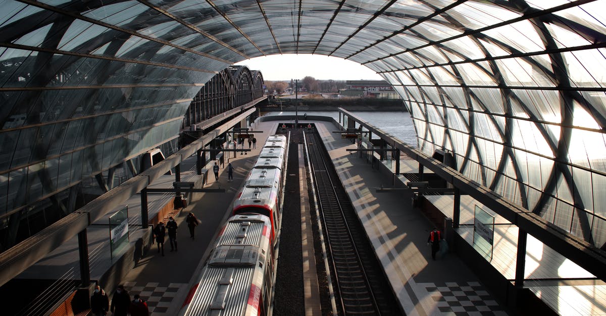 What is the relation between Lille Europe and Lille Flandres railway stations? [duplicate] - People Walking on Train Station