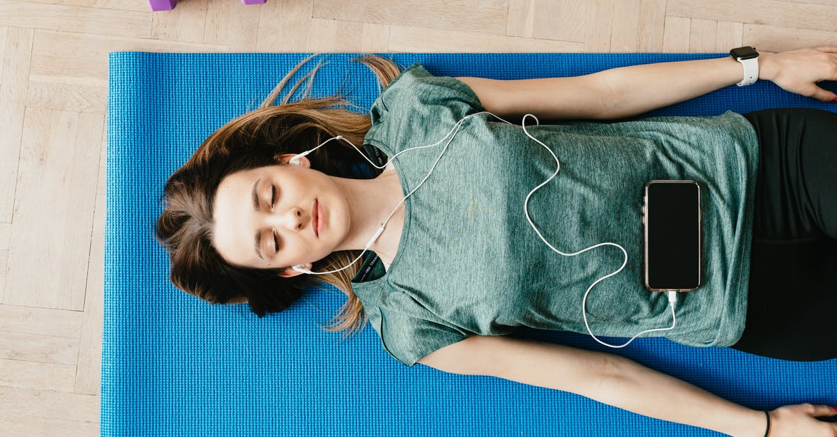 What is the use of a blue UN Laissez-Passer? - Peaceful woman in earphones resting in Shavasana pose at home What is the use of a blue UN Laissez-Passer? - Peaceful woman in earphones resting in Shavasana pose at home