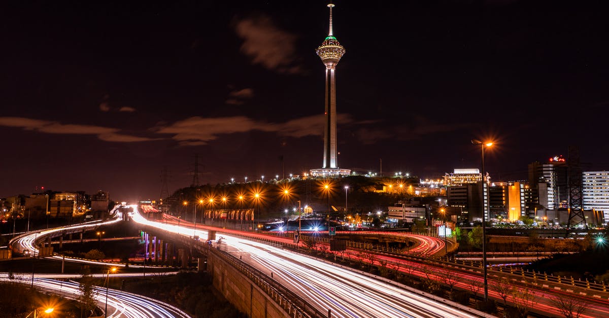 What is this arch-and-tower near a road? - A Time Lapse Photography of City Lights at Night What is this arch-and-tower near a road? - A Time Lapse Photography of City Lights at Night
