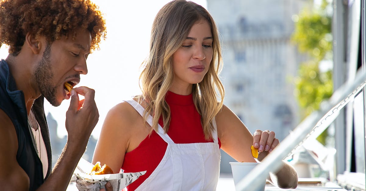 What is this Israeli street food dish? - Happy young multiracial friends having lunch in street cafe