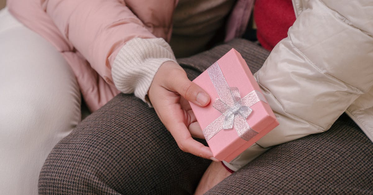 What is this present we received from our hotel in China? [closed] - Woman with gift from boyfriend sitting close