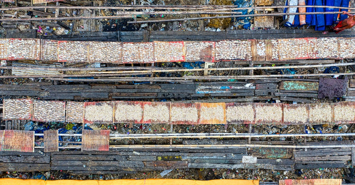 What is typical (traditional) Lao / Laotian food? - Aerial view of big old shabby outdoor fish market located in Jakarta district in daytime What is typical (traditional) Lao / Laotian food? - Aerial view of big old shabby outdoor fish market located in Jakarta district in daytime