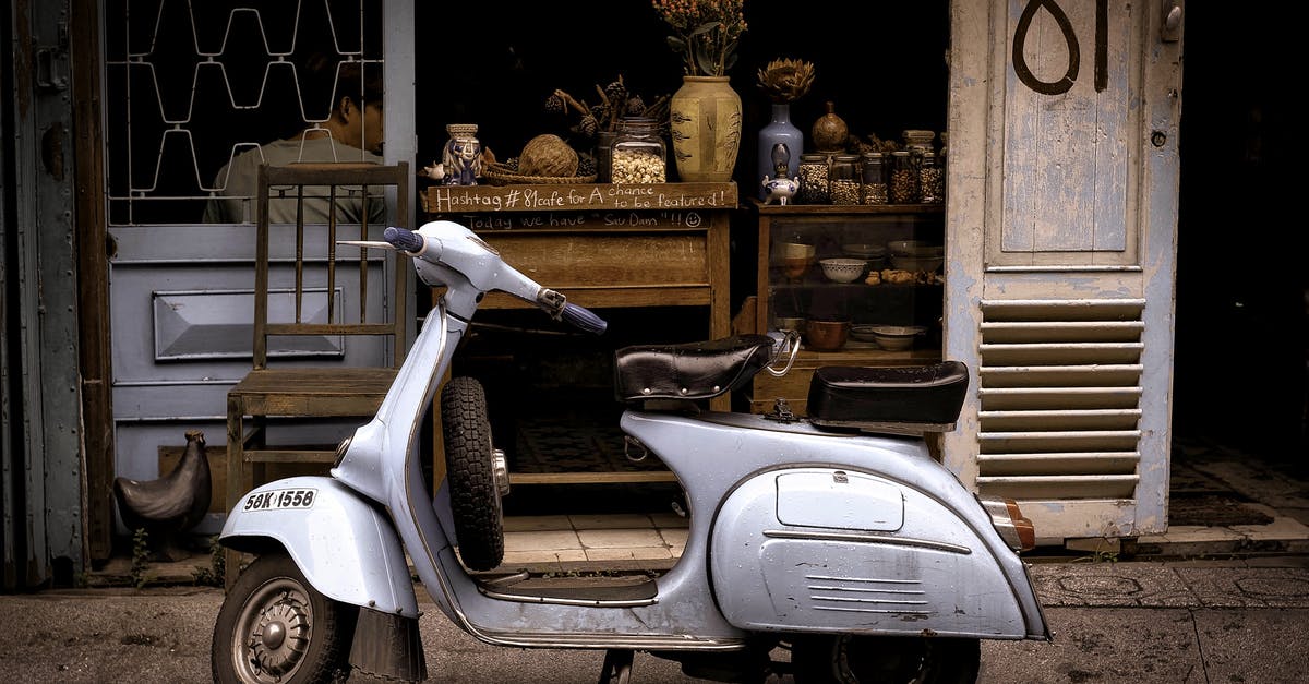 What kind of car can I drive in italy with an IDP with a less than year old license? - White and Black Motor Scooter Parked Near Building What kind of car can I drive in italy with an IDP with a less than year old license? - White and Black Motor Scooter Parked Near Building